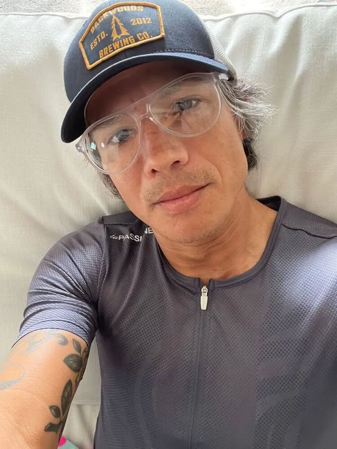 Antonio in LOOK OPTIC Liam readers in clear, wearing a cap