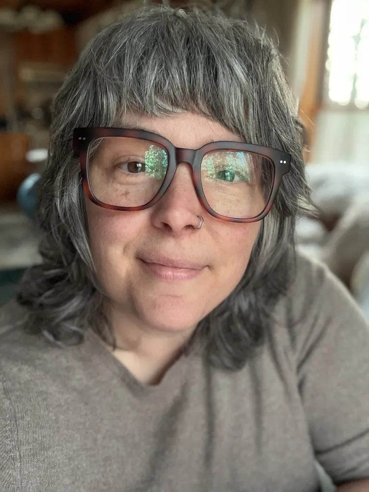 Crystal wearing LOOK OPTIC Laurel readers in Tortoise