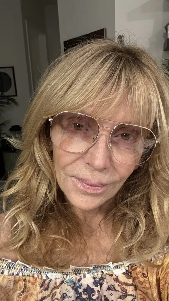 Debi wearing LOOK OPTIC Muse Progressives with warm-toned frames