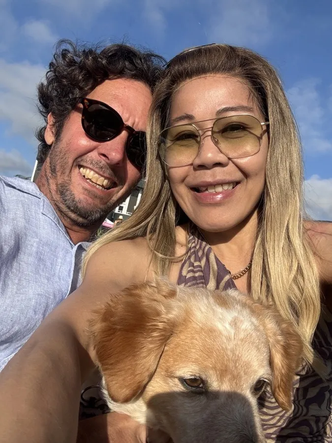 A couple selfie with their dog, the man wearing LOOK OPTIC sunglasses