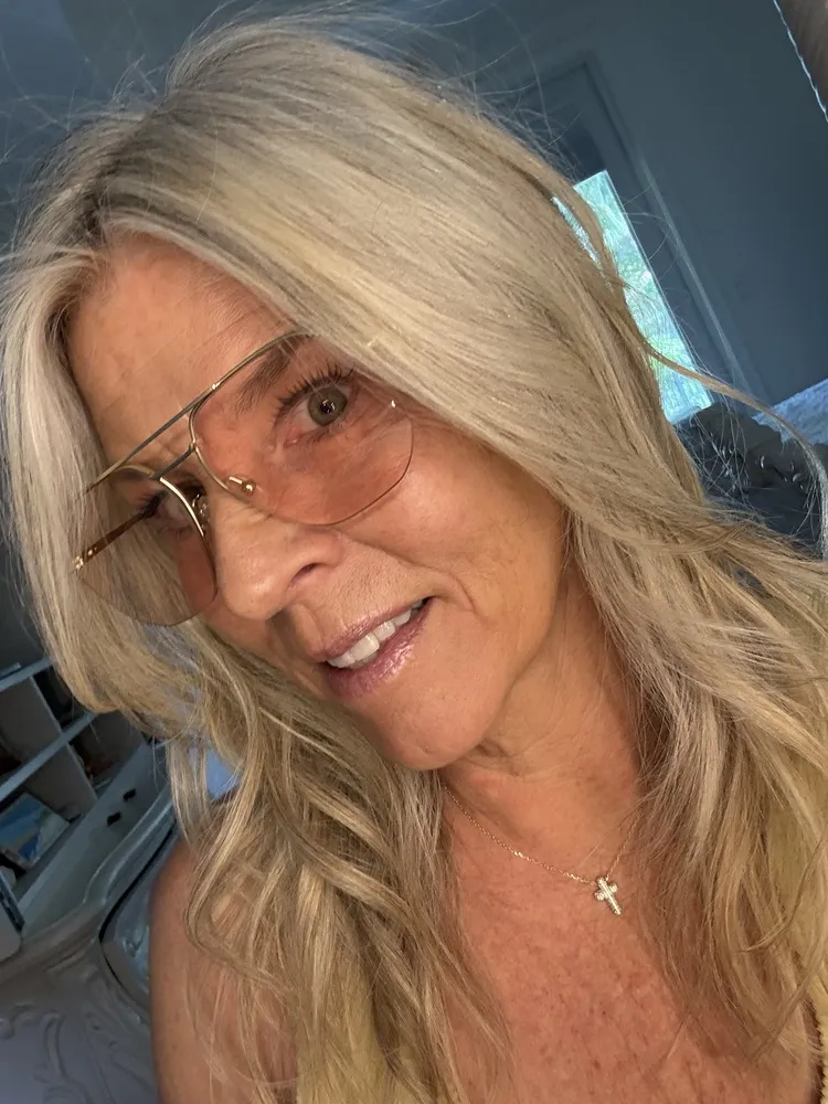 Kim wearing LOOK OPTIC Muse frames with pink-tinted lenses