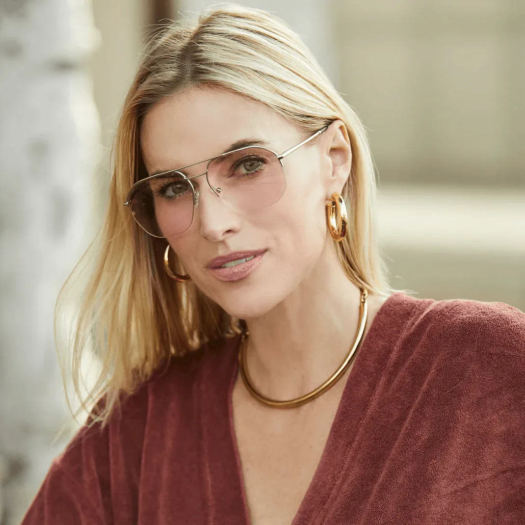 A lightweight LOOK OPTIC frame balanced on a fingertip
