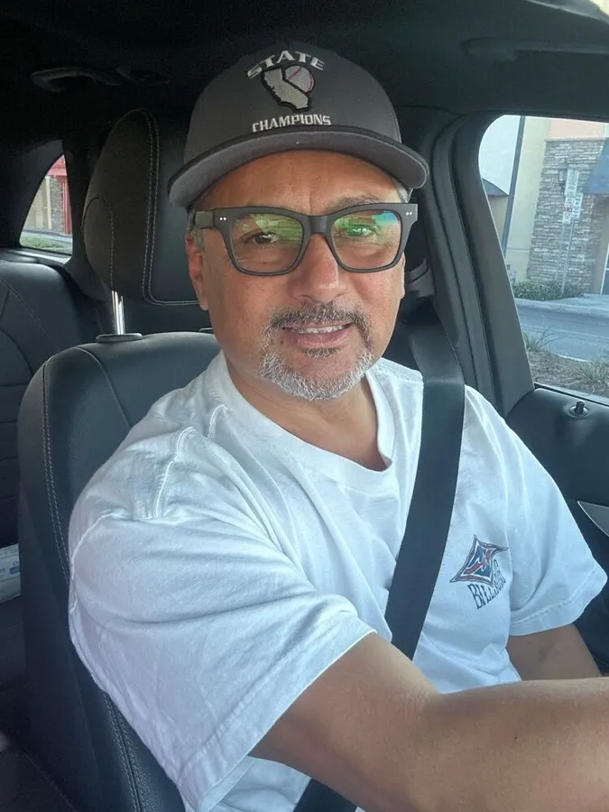 A man driving in LOOK OPTIC Cosmo frames with tinted lenses